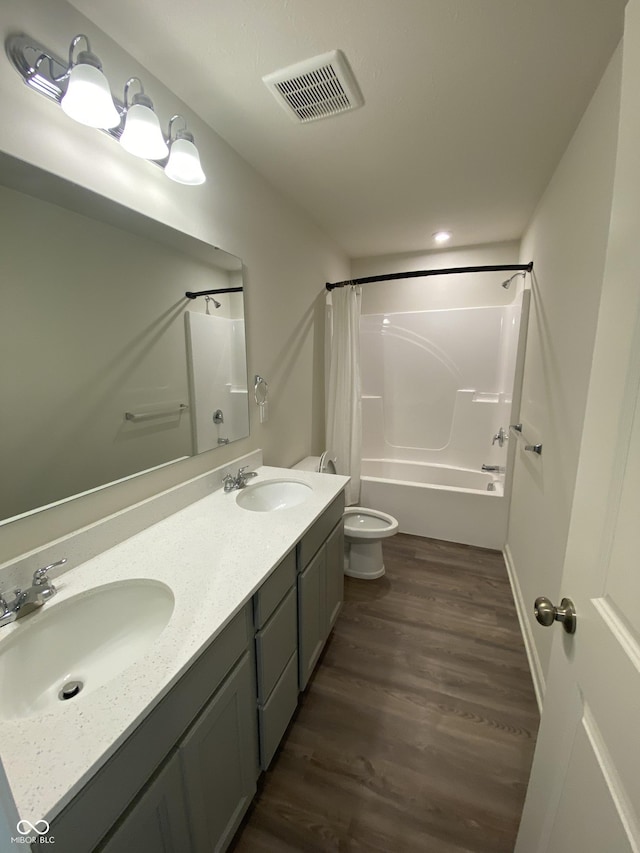 full bathroom featuring toilet, vanity, shower / bath combo, and hardwood / wood-style flooring