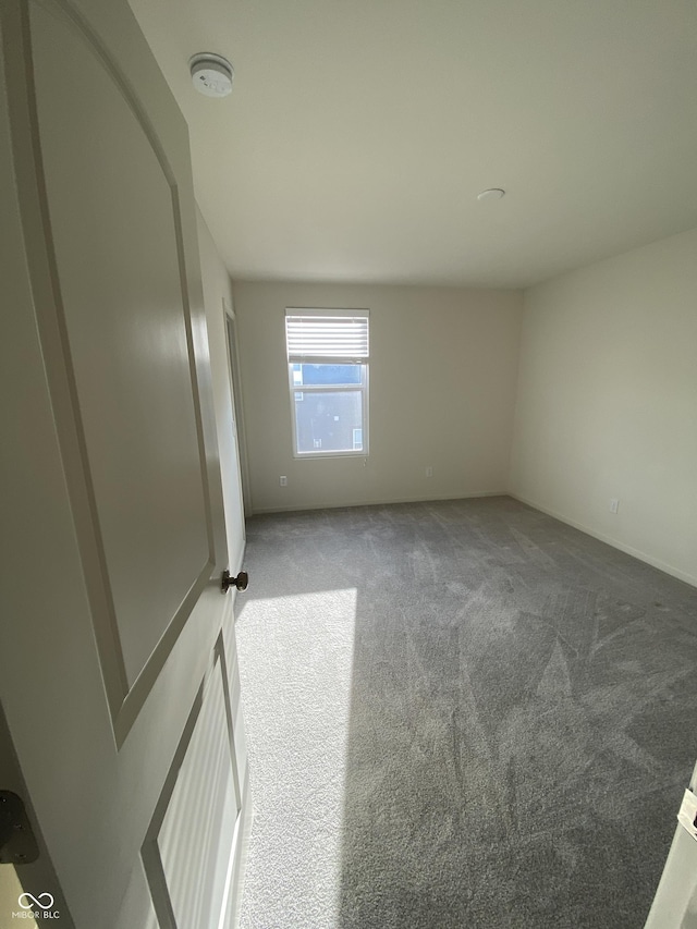 unfurnished room with carpet floors