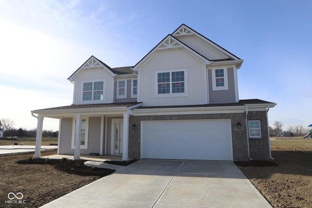 craftsman-style home featuring covered porch and a garage