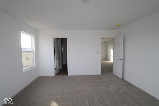 spare room with light colored carpet