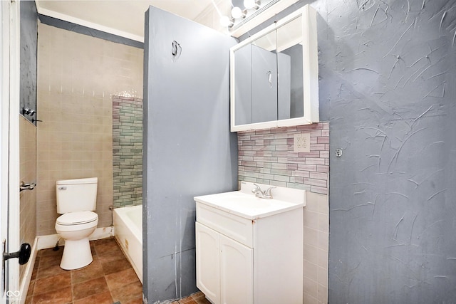 bathroom featuring vanity, toilet, and tile walls