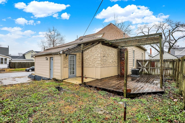 back of property featuring a deck