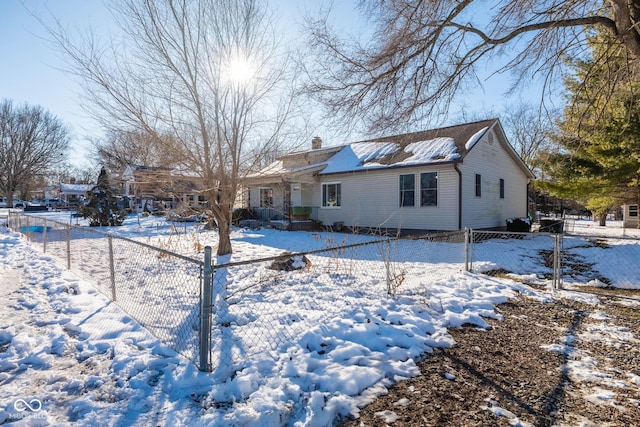 view of snow covered house