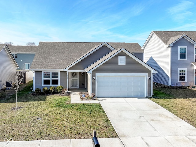 view of front of home with a front yard, central AC, and a garage