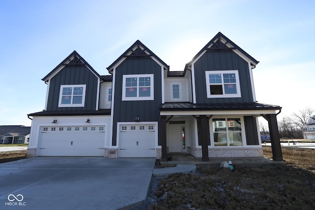 view of front of house with a porch and a garage