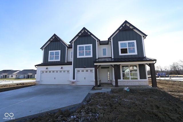 view of front of property with a porch and a garage