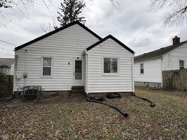 back of house featuring central AC