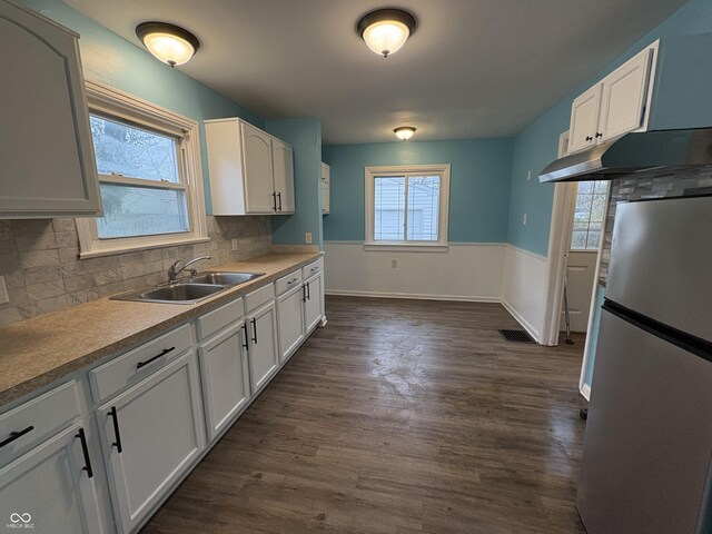 3919 E 34th St, Indianapolis, IN 46218 - kitchen featuring freestanding refrigerator, white cabinetry, and dark wood-type flooring