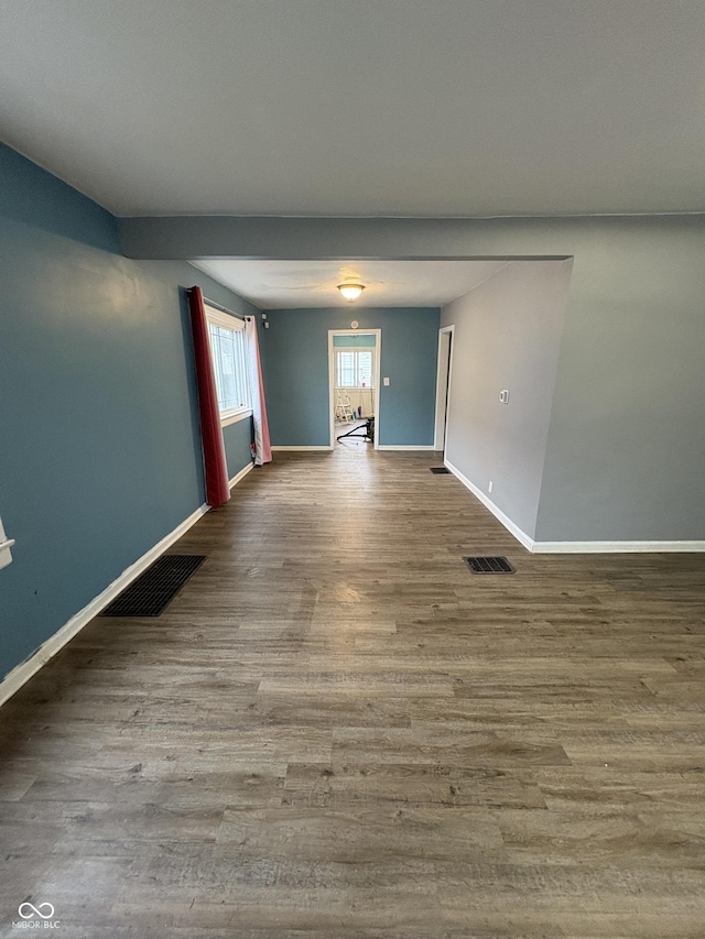 spare room with hardwood / wood-style floors