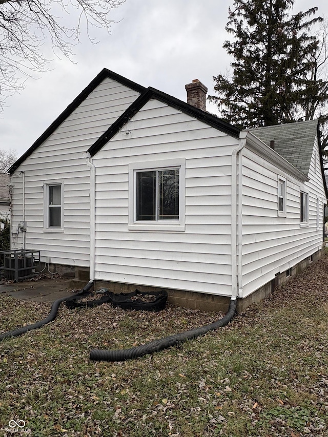 3919 E 34th St, Indianapolis, IN 46218 - view of side of home with a chimney