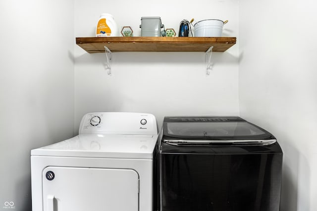 laundry area featuring washing machine and clothes dryer