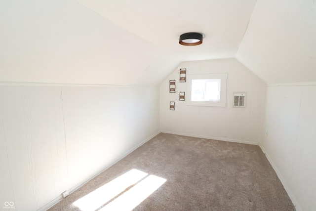 bonus room featuring carpet flooring and lofted ceiling