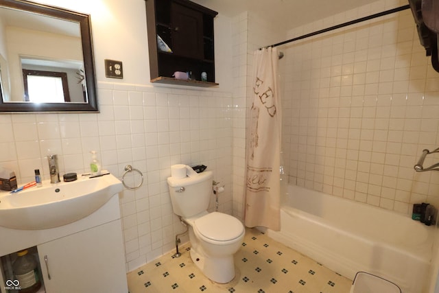 full bathroom featuring shower / bath combo, toilet, tile walls, and vanity