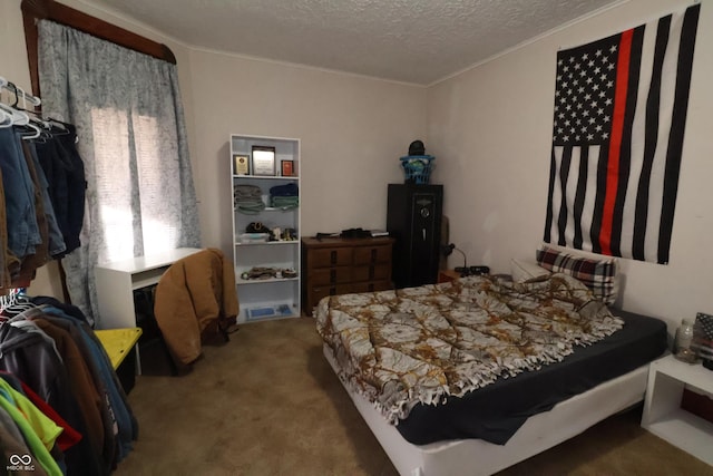 bedroom featuring light carpet and a textured ceiling