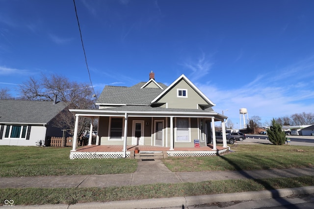 view of front of property featuring a front yard and a porch