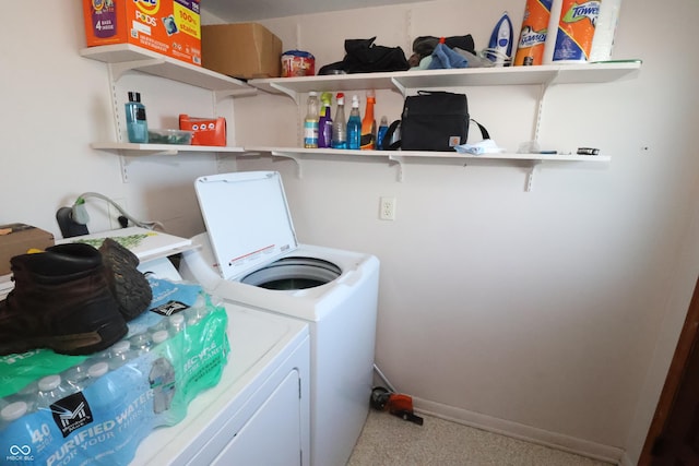 washroom with carpet and separate washer and dryer