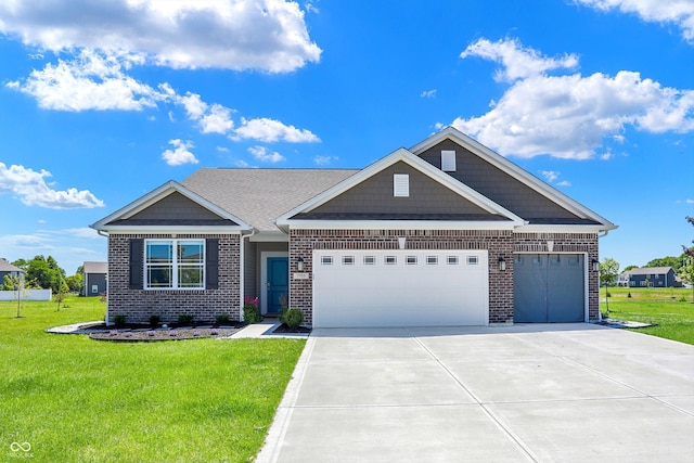 view of front of house with a garage and a front yard