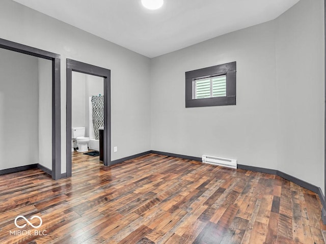 unfurnished bedroom featuring dark wood-type flooring