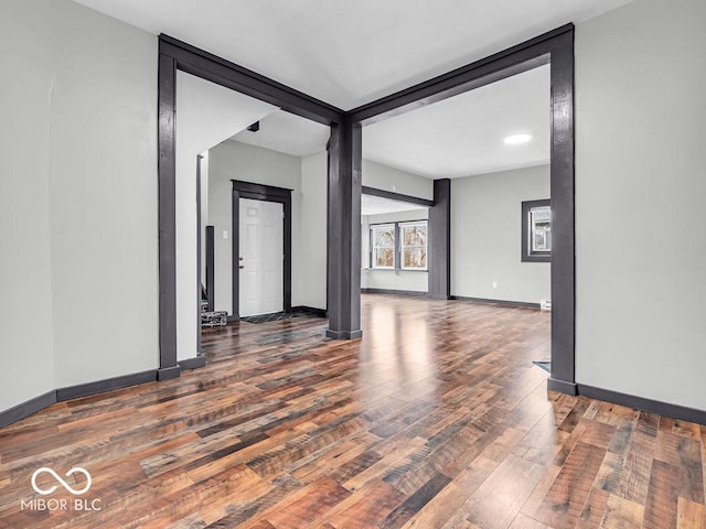 spare room featuring dark wood-type flooring