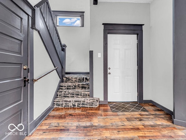 entryway with wood-type flooring