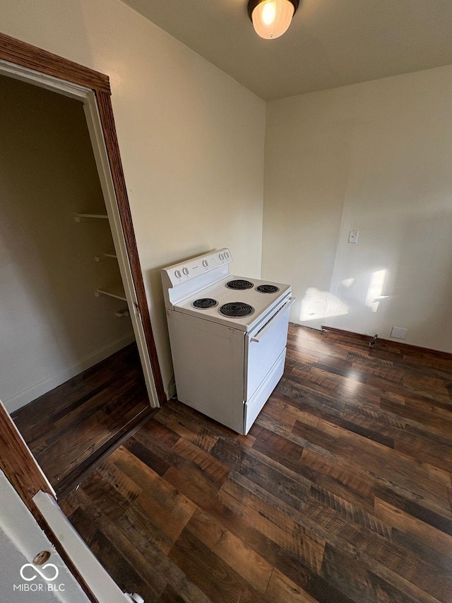 kitchen featuring electric range, white cabinetry, and dark hardwood / wood-style floors