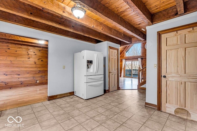 interior space featuring beam ceiling, white fridge with ice dispenser, wood ceiling, and light hardwood / wood-style floors