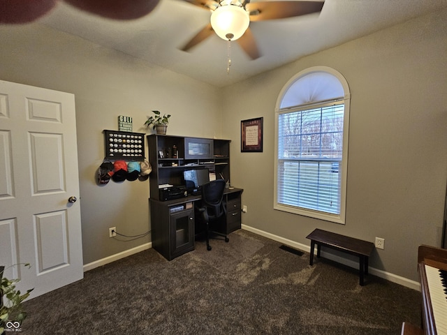 office space with ceiling fan and dark carpet