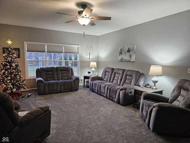 carpeted living room with ceiling fan