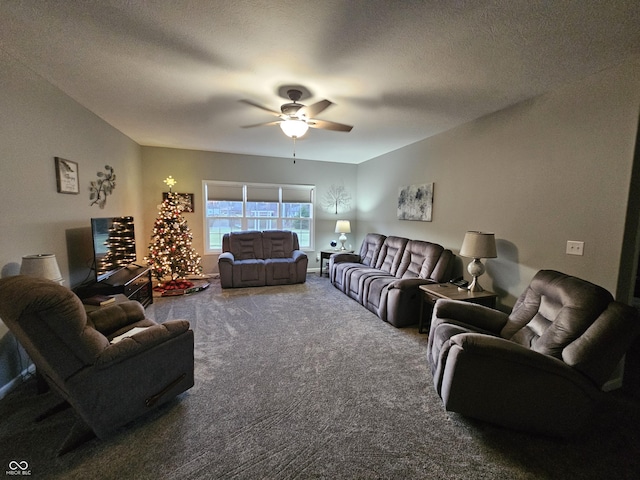 carpeted living room featuring a textured ceiling and ceiling fan