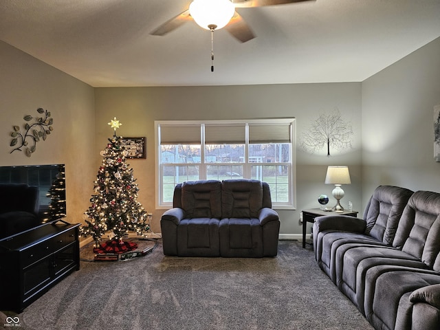 carpeted living room with ceiling fan