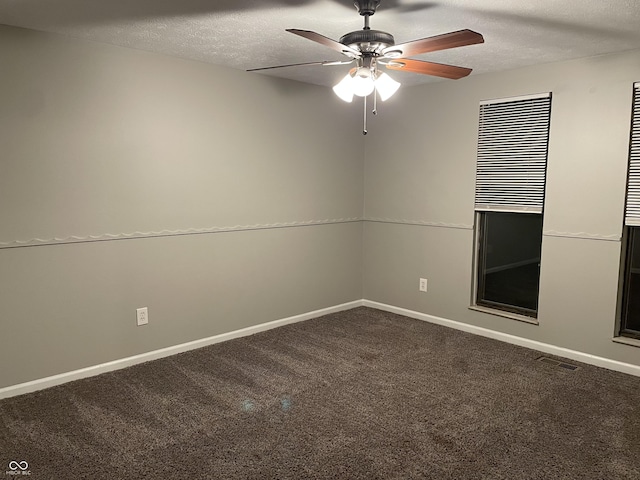 carpeted empty room featuring a textured ceiling and ceiling fan