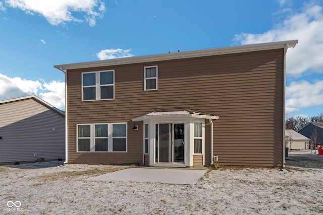 rear view of property featuring a patio