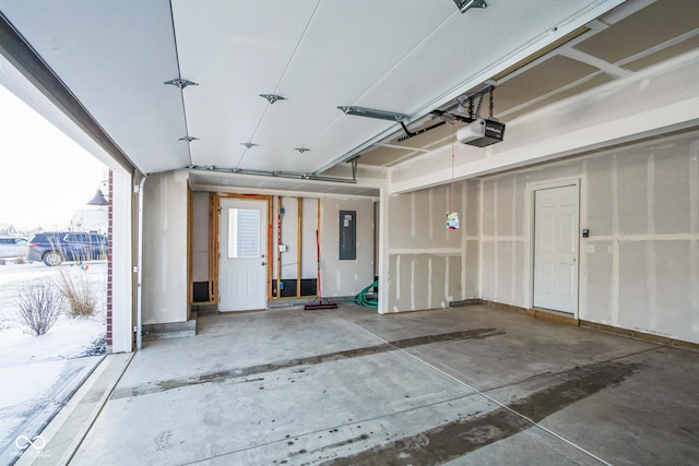 garage with electric panel and a garage door opener