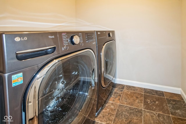 laundry room with separate washer and dryer