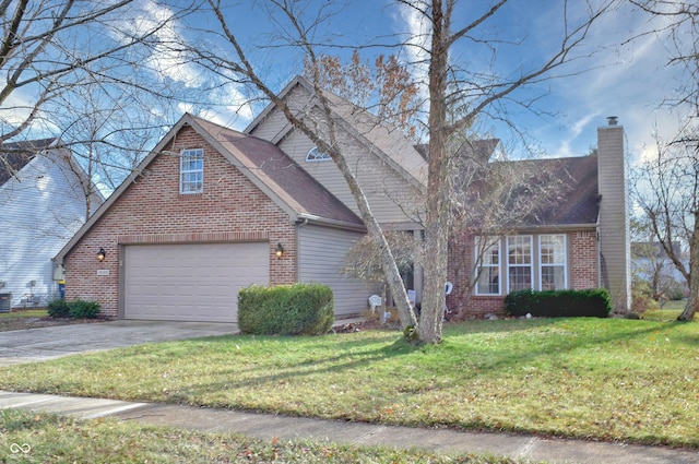 view of front of house with a front yard and a garage