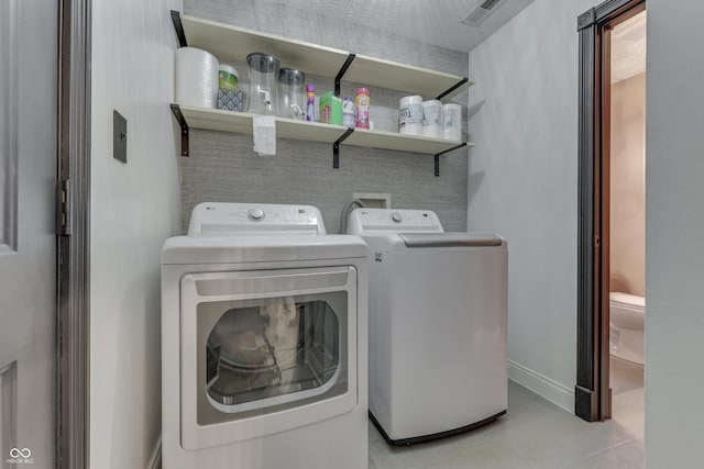 washroom with washer and clothes dryer