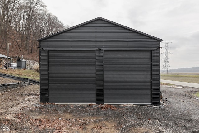 view of outbuilding with a garage