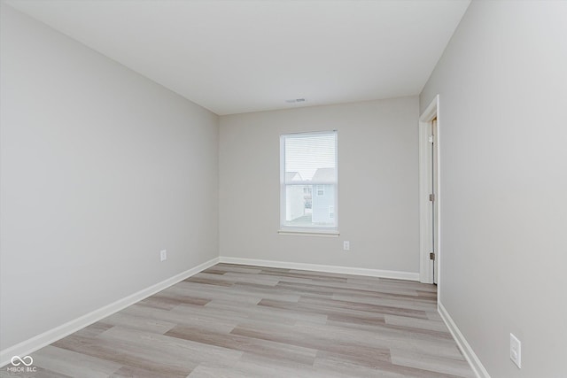 empty room with light wood-type flooring