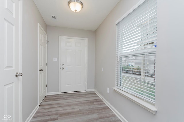 entryway with light hardwood / wood-style flooring