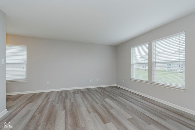 unfurnished room featuring light hardwood / wood-style floors