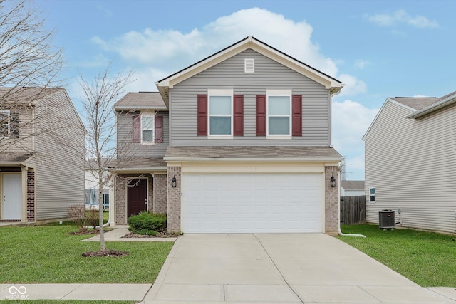 view of front property featuring a front lawn, cooling unit, and a garage