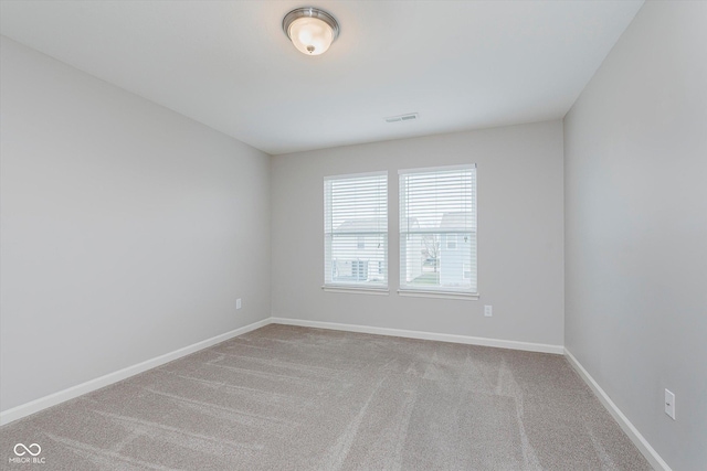 unfurnished room featuring carpet flooring