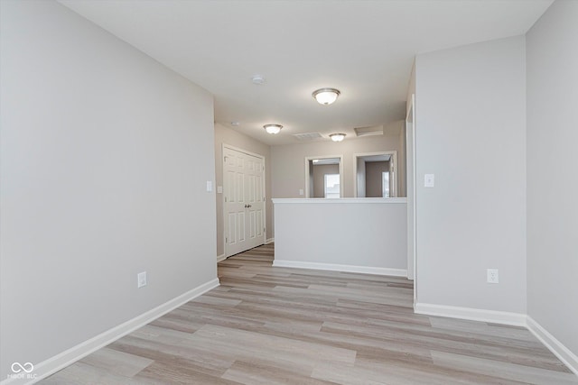 spare room featuring light hardwood / wood-style flooring