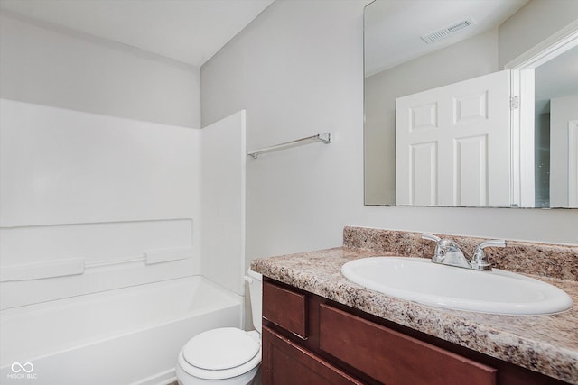 full bathroom with vanity,  shower combination, and toilet