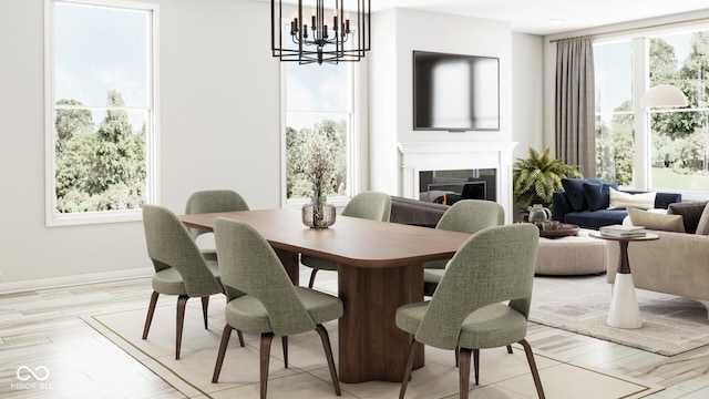 dining area with an inviting chandelier, plenty of natural light, and light hardwood / wood-style floors