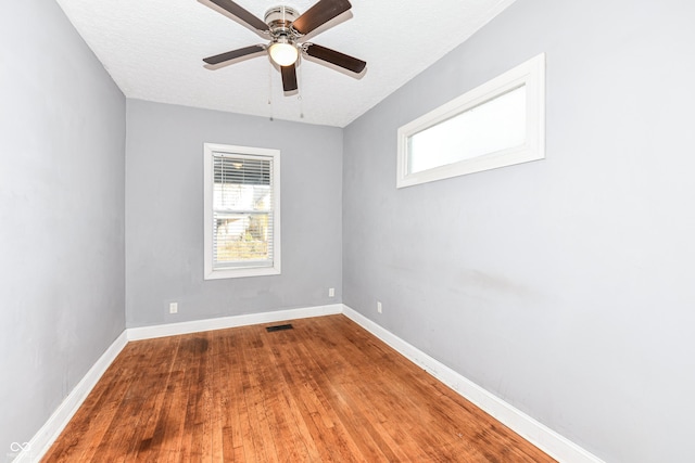 3458 N Kenwood Ave, Indianapolis, IN 46208 - unfurnished room with plenty of natural light, wood finished floors, and a ceiling fan