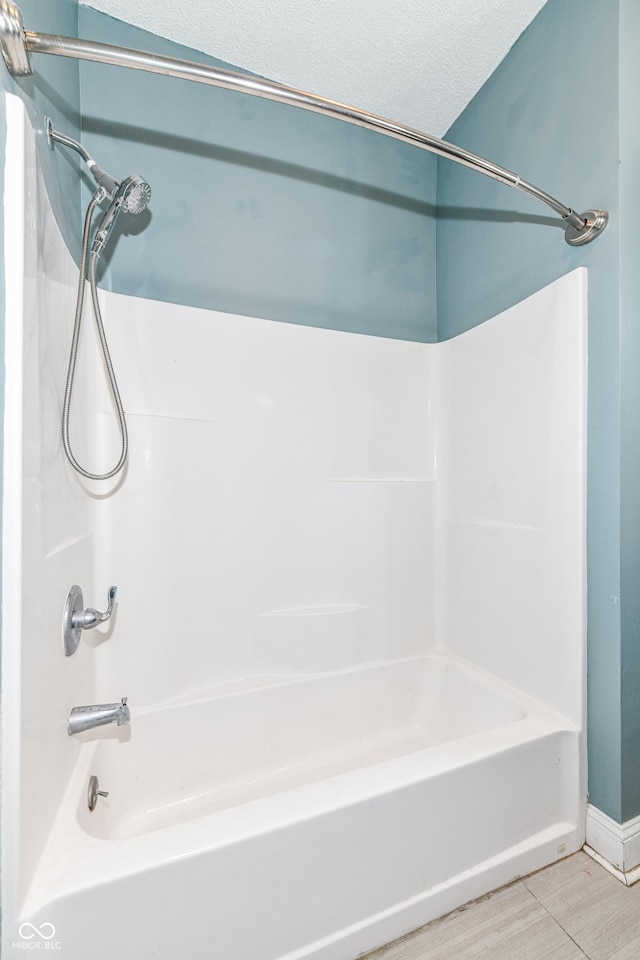 3458 N Kenwood Ave, Indianapolis, IN 46208 - full bathroom with shower / bathtub combination, wood finished floors, and a textured ceiling