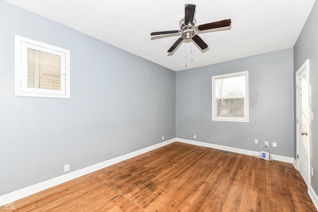 3458 N Kenwood Ave, Indianapolis, IN 46208 - unfurnished room with wood finished floors, ceiling fan, and a textured ceiling