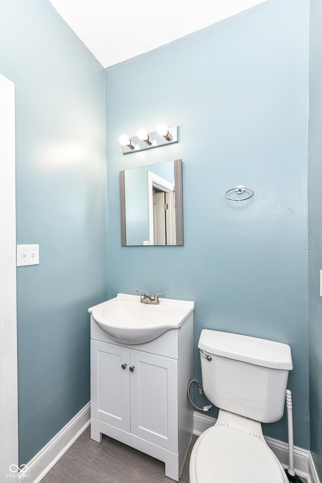 3458 N Kenwood Ave, Indianapolis, IN 46208 - bathroom with baseboards and vanity