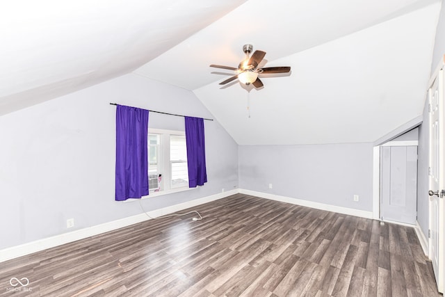 additional living space featuring ceiling fan, lofted ceiling, and hardwood / wood-style flooring